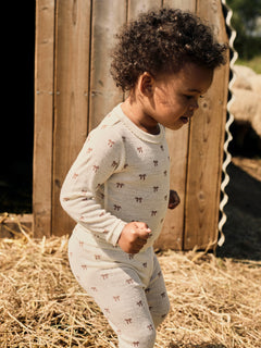 Babypyjama met strikjes