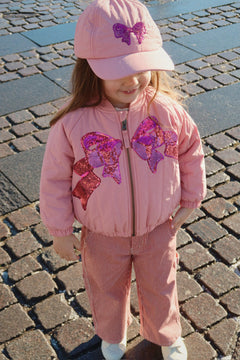 Roze kinderjas met strik geborduurd